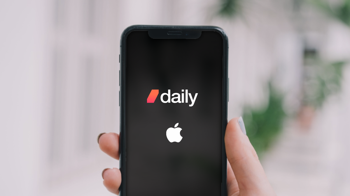 An iPhone with the Daily and Apple logos